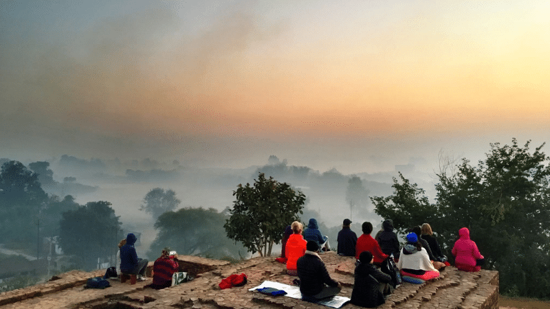 people meditating early morning mist
